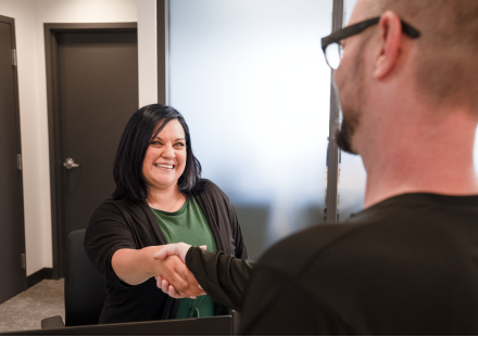 Patient shaking employees hand